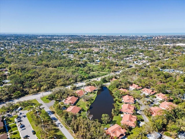 bird's eye view featuring a water view and a residential view