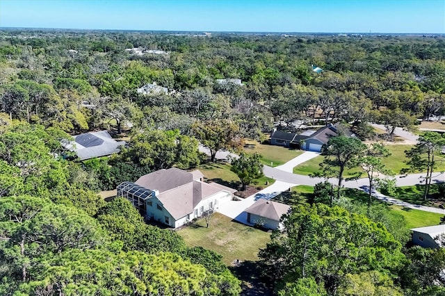 drone / aerial view with a view of trees