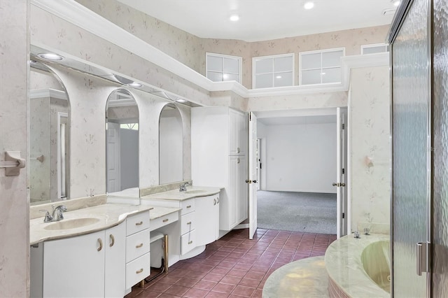 bathroom featuring tile patterned flooring, wallpapered walls, and a garden tub