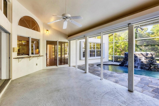 view of patio with a lanai, an outdoor pool, and a ceiling fan