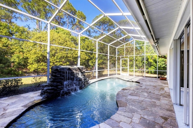 pool with a patio and a lanai