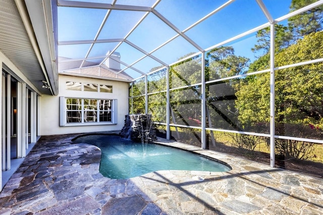 outdoor pool featuring a lanai and a patio area