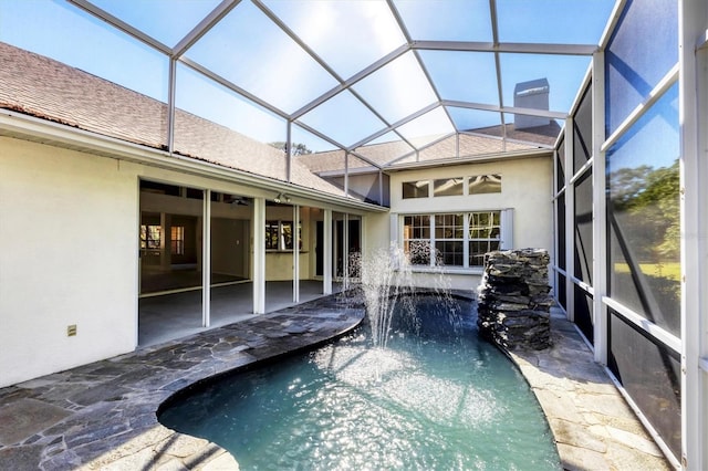 outdoor pool featuring a patio and a lanai