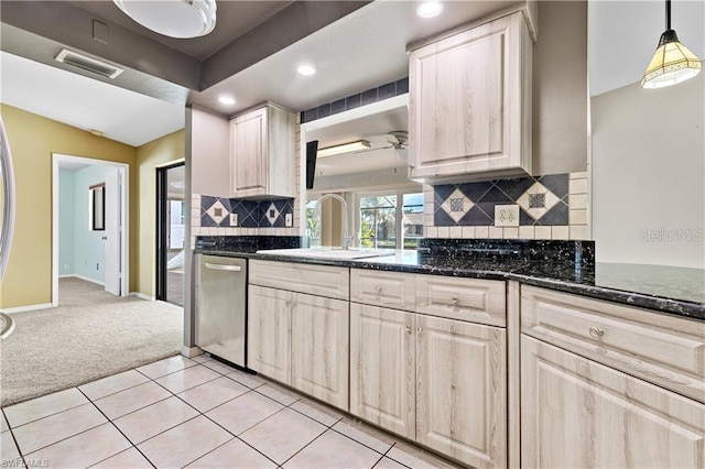 kitchen with recessed lighting, a sink, visible vents, dishwasher, and light colored carpet