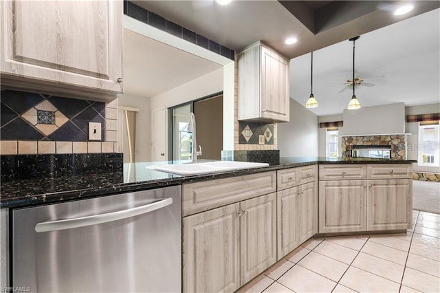 kitchen with a wealth of natural light, ceiling fan, dishwasher, and a sink