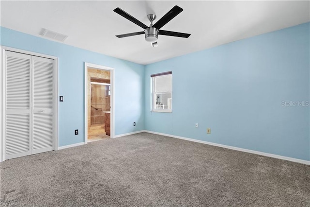 unfurnished bedroom featuring visible vents, a closet, baseboards, carpet floors, and a ceiling fan