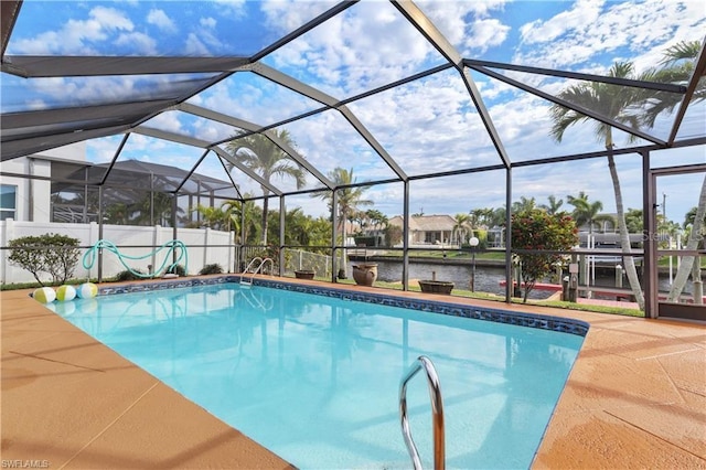 view of pool with a fenced in pool, a patio area, a water view, and a lanai