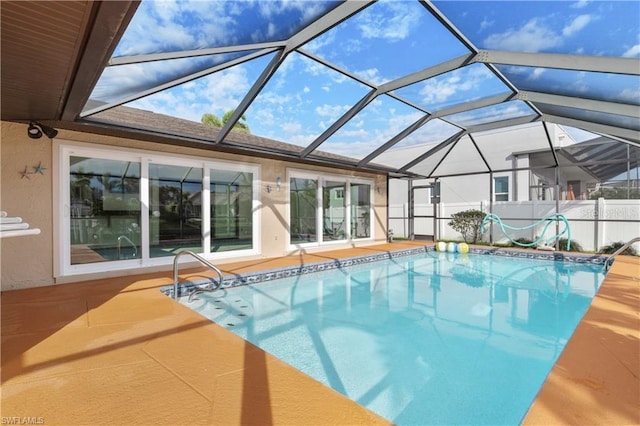 view of swimming pool with a lanai, a patio area, and a fenced in pool