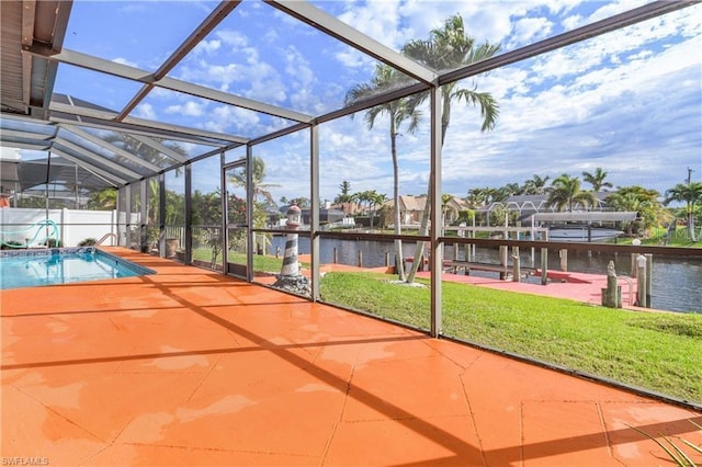 unfurnished sunroom featuring a water view