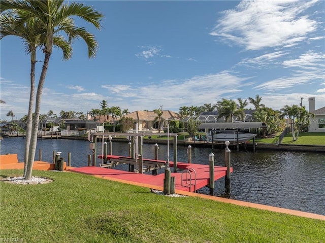 dock area featuring a lawn, a water view, a residential view, and boat lift