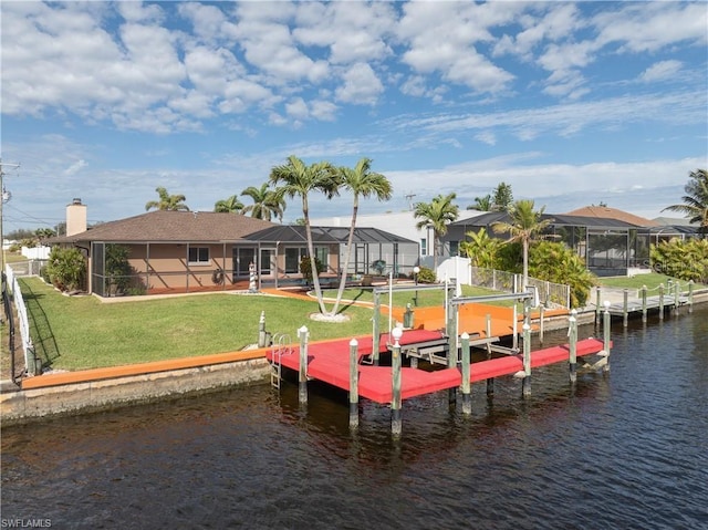 view of dock with a lawn, a water view, glass enclosure, and boat lift