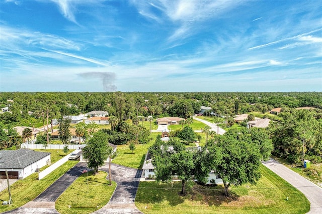 birds eye view of property with a forest view