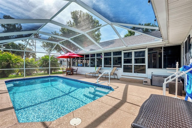 view of swimming pool with a patio