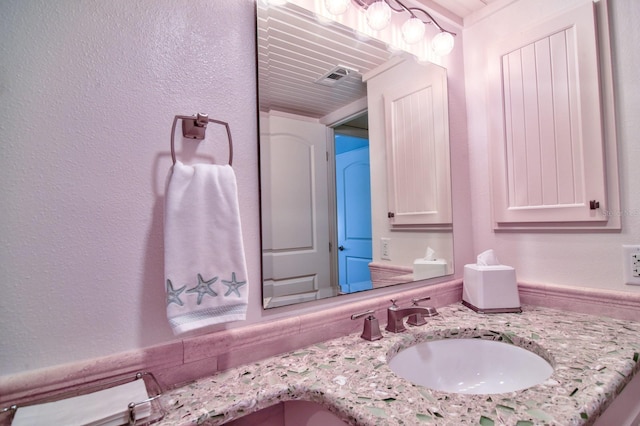 bathroom featuring visible vents and vanity