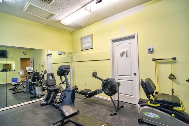 workout area featuring attic access