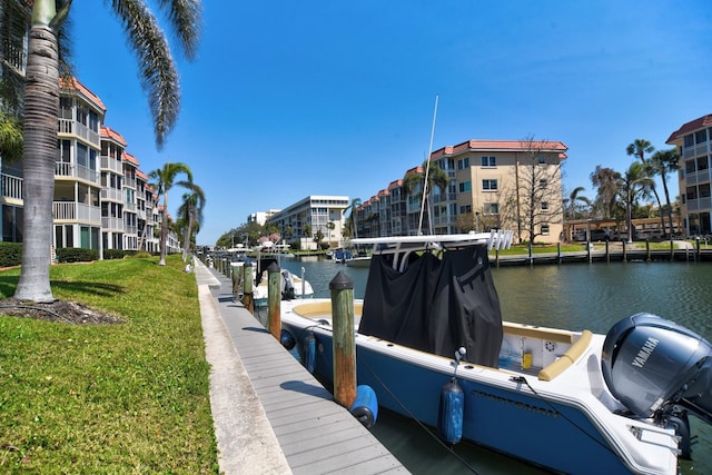 dock area featuring a yard and a water view