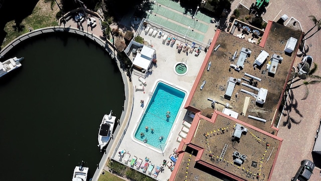 birds eye view of property with a water view