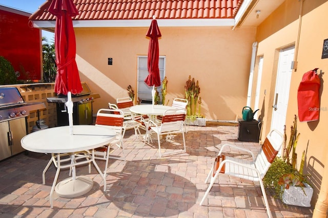 view of patio featuring outdoor dining space and a pergola