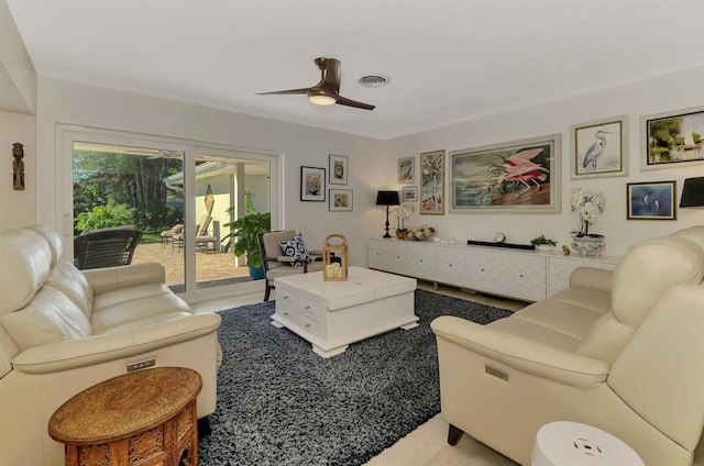 living room featuring visible vents and a ceiling fan