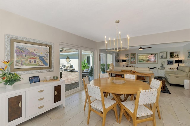 dining area featuring light tile patterned floors and a notable chandelier