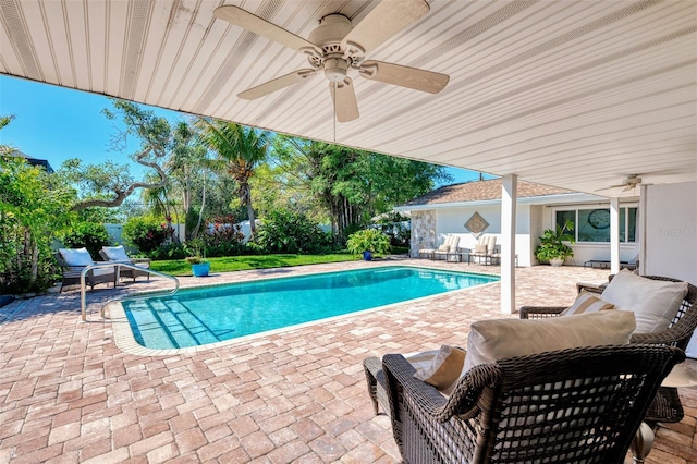 view of pool with a ceiling fan, a patio, and a fenced in pool