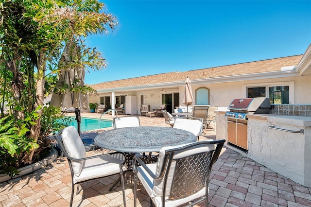 view of patio with an outdoor pool, ceiling fan, outdoor dining space, area for grilling, and a grill