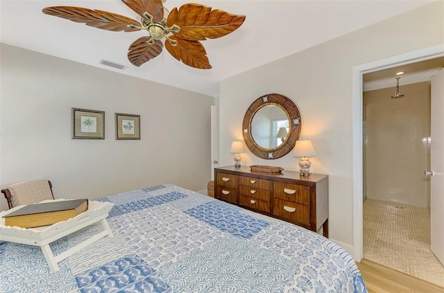 bedroom featuring ceiling fan, visible vents, and light wood-type flooring