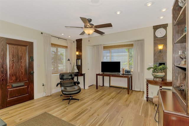 living area featuring recessed lighting, light wood-style flooring, baseboards, and ceiling fan