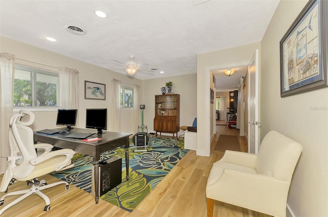 office area featuring wood finished floors, baseboards, visible vents, recessed lighting, and ceiling fan