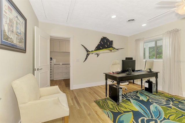 office area with light wood-type flooring, visible vents, a ceiling fan, recessed lighting, and baseboards