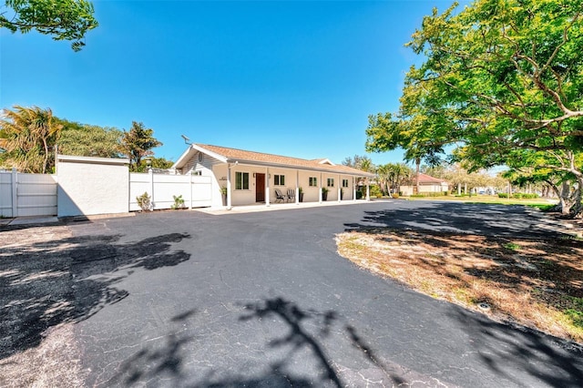 view of front of home featuring fence