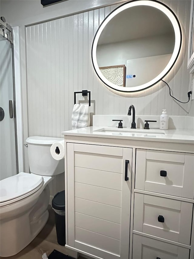 bathroom with toilet and vanity