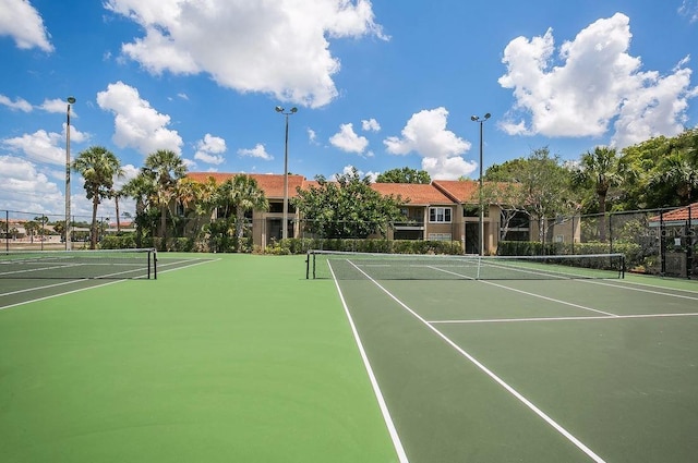 view of tennis court with fence