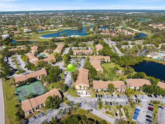 birds eye view of property featuring a water view and a residential view