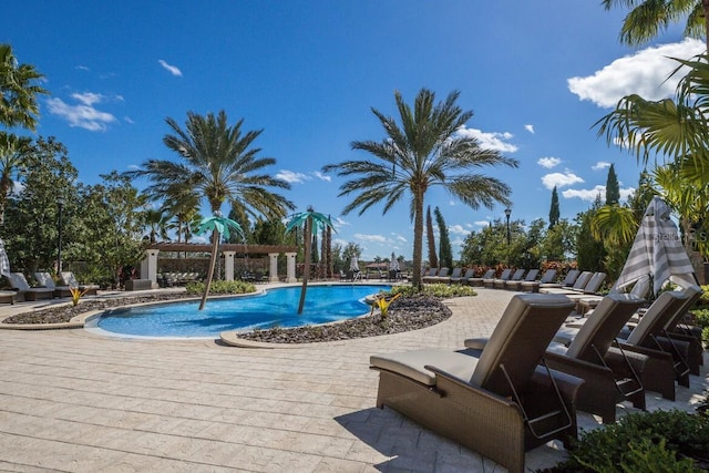 community pool featuring a patio area