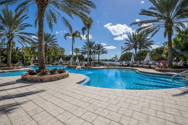 community pool featuring a patio area