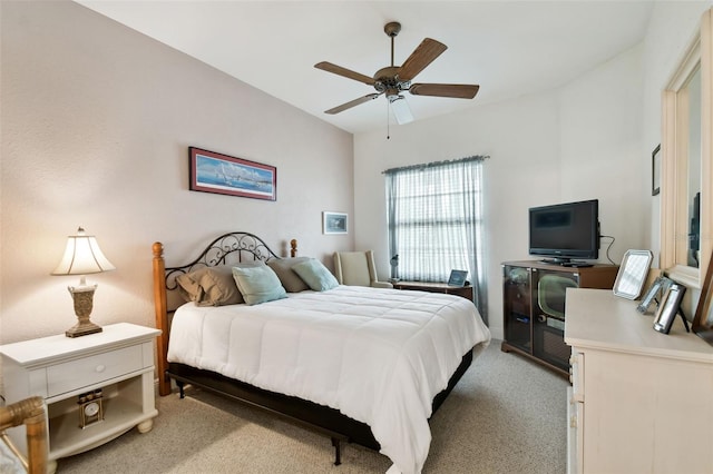 bedroom with ceiling fan and light carpet