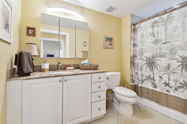 bathroom featuring vanity, visible vents, curtained shower, tile patterned floors, and toilet