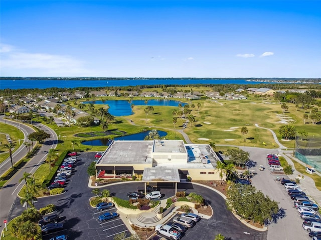 aerial view featuring a water view and golf course view