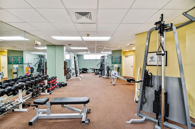 exercise room featuring a drop ceiling and visible vents