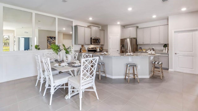 dining area with recessed lighting, visible vents, and light tile patterned floors