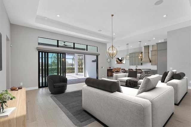 4629 Antrim Dr, Sarasota, FL 34240 - living area featuring recessed lighting, light wood finished floors, baseboards, and an inviting chandelier
