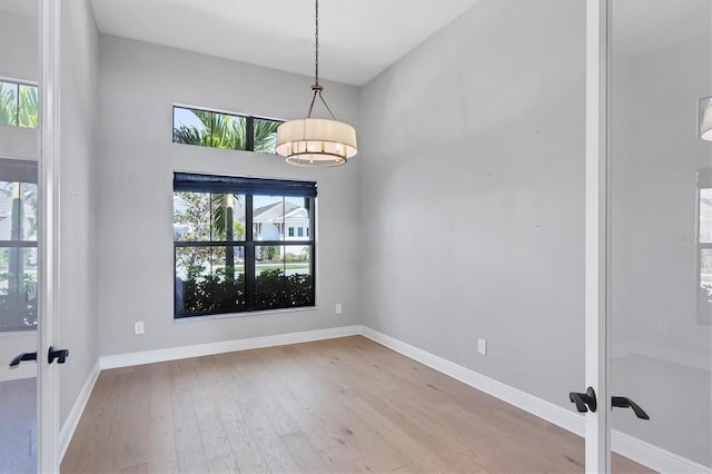 4629 Antrim Dr, Sarasota, FL 34240 - empty room with baseboards, french doors, and wood finished floors