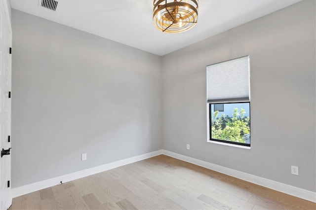 4629 Antrim Dr, Sarasota, FL 34240 - spare room with visible vents, baseboards, and wood finished floors