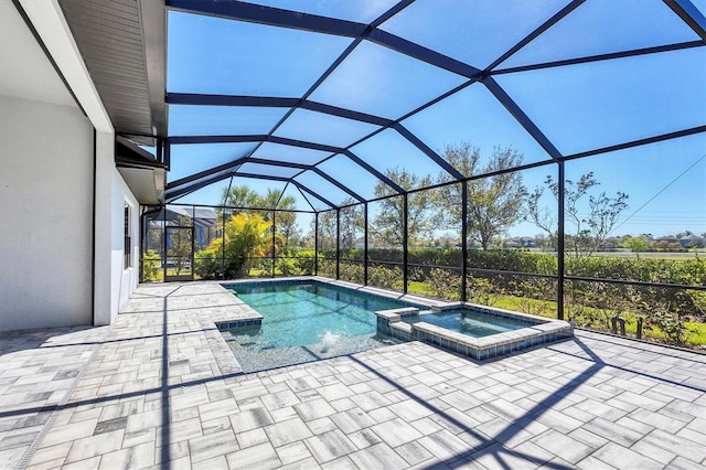 4629 Antrim Dr, Sarasota, FL 34240 - view of pool featuring glass enclosure, a pool with connected hot tub, and a patio
