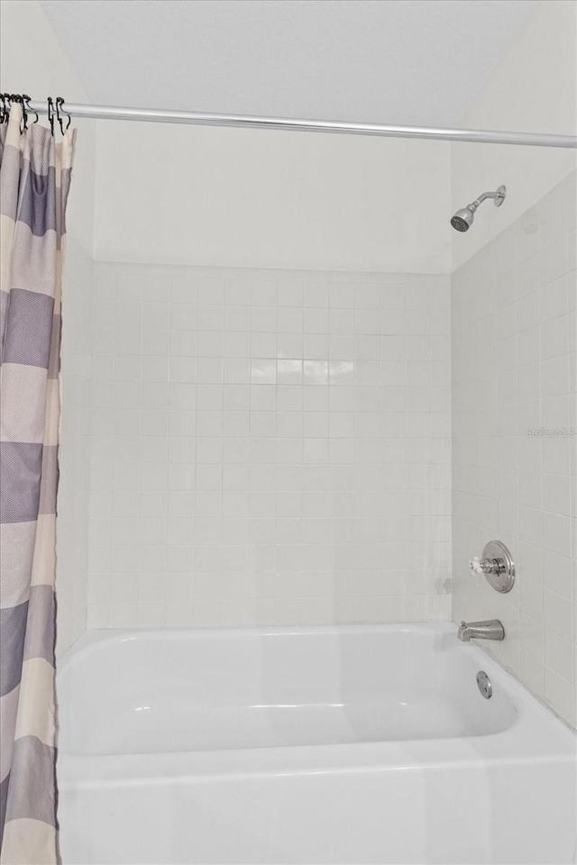 full bathroom with shower / bathtub combination with curtain