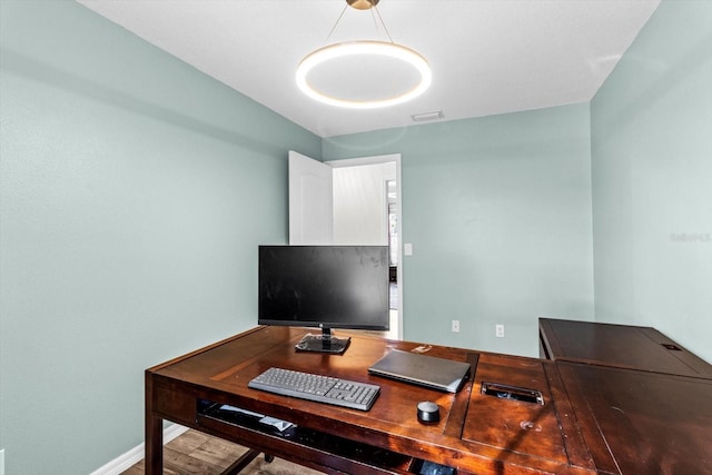 office area with baseboards and visible vents