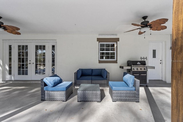 view of patio / terrace with grilling area, an outdoor living space, french doors, and a ceiling fan