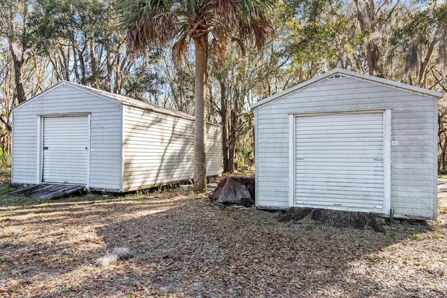 garage featuring a shed