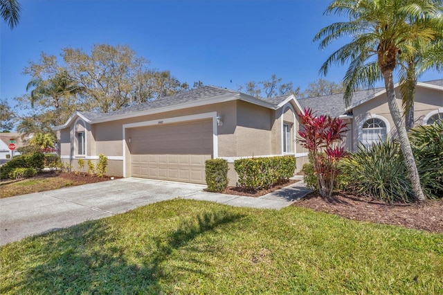 ranch-style home with stucco siding, an attached garage, concrete driveway, and a front yard